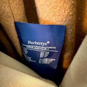 Burberry Tan Trench coat. Used very few times, slight stain, can be dry cleaned